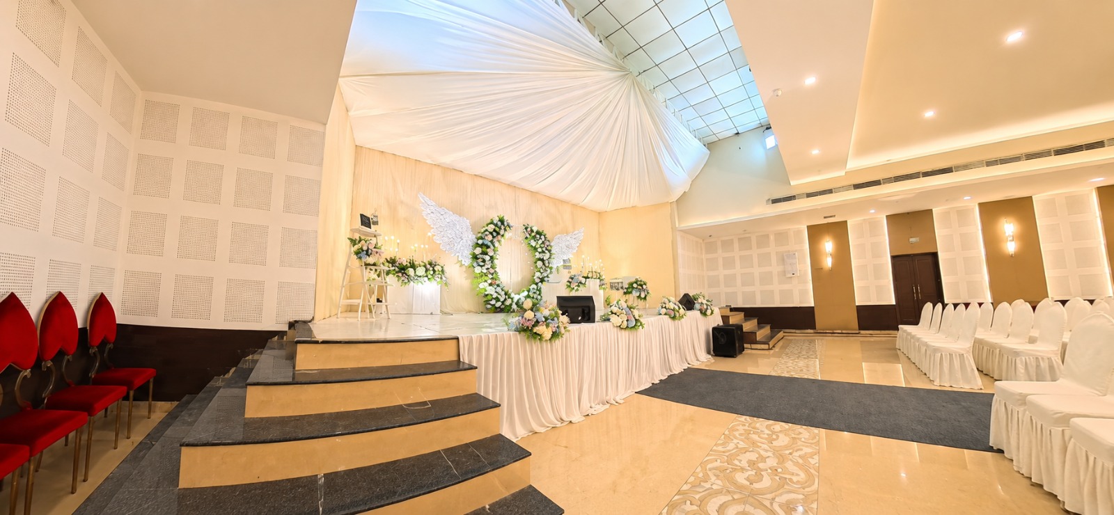 Decorated stage with floral backdrop